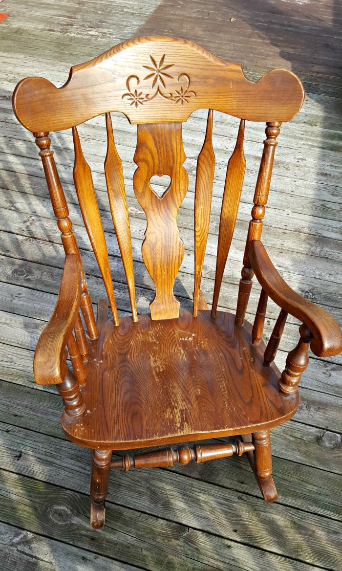 Our nursery rocking chair was in need of a makeover for our third child...so I figured out how to spray paint a wooden rocking chair for less than $10!