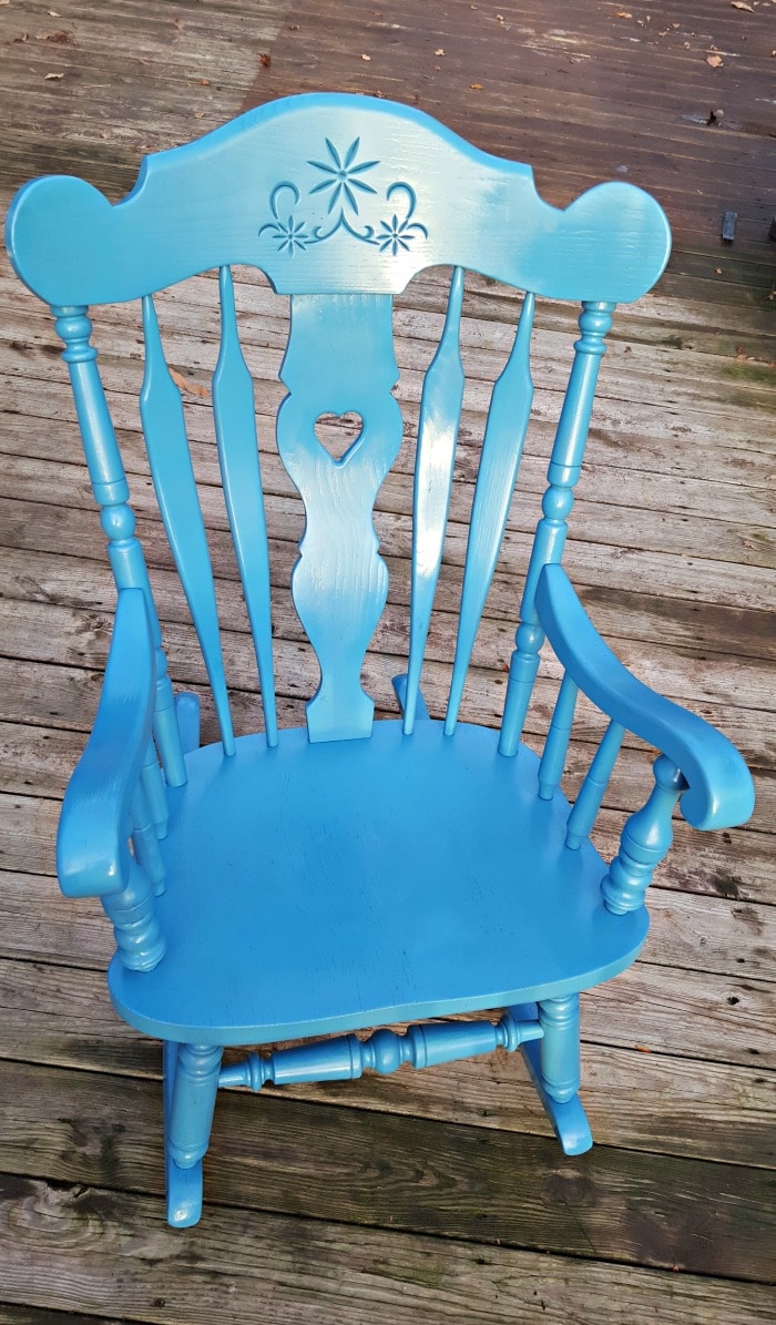 Our nursery rocking chair was in need of a makeover for our third child...so I figured out how to spray paint a wooden rocking chair for less than $10!